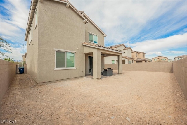 rear view of house with a patio