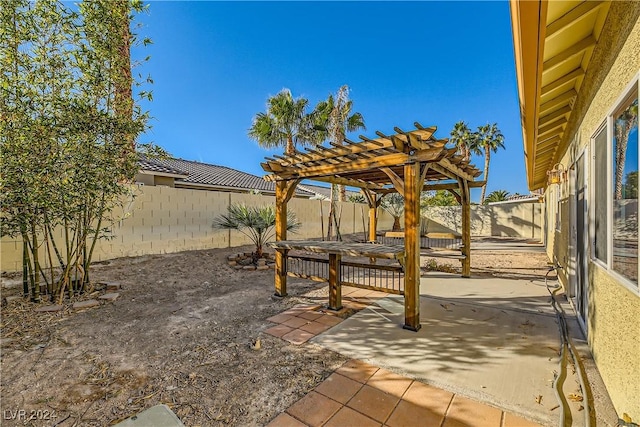 view of yard with a patio area, a fenced backyard, and a pergola