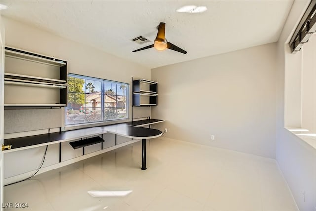 home office featuring baseboards, visible vents, and a ceiling fan