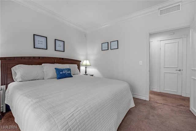 carpeted bedroom featuring ornamental molding