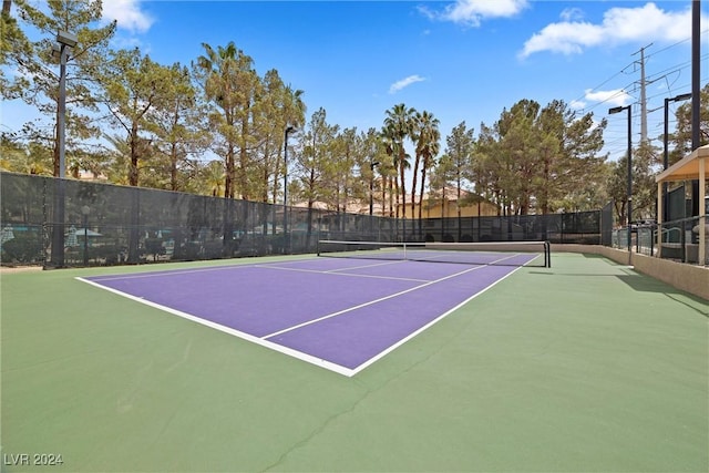 view of sport court with basketball hoop