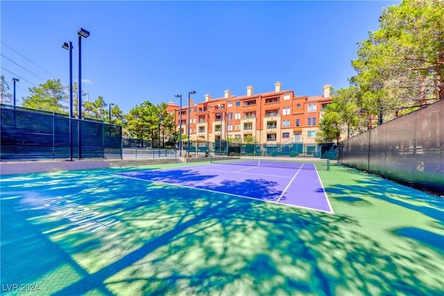 view of tennis court featuring basketball court