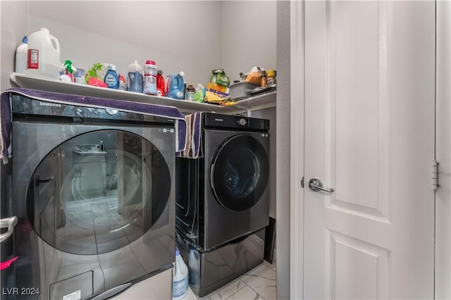 washroom featuring washer and dryer