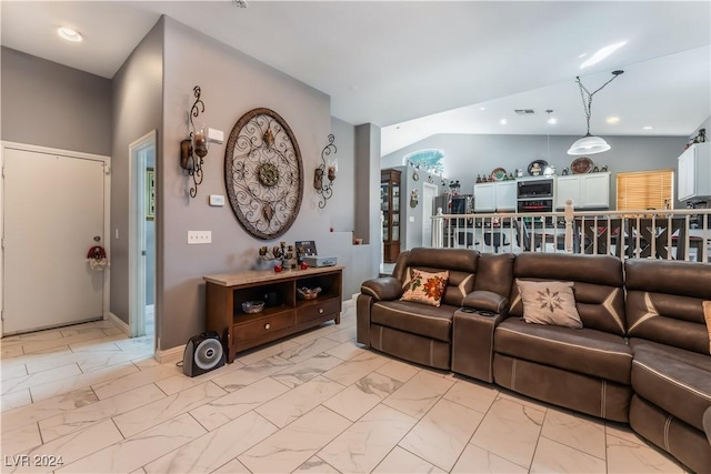 living room featuring vaulted ceiling