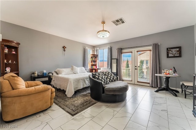 bedroom featuring french doors and access to outside