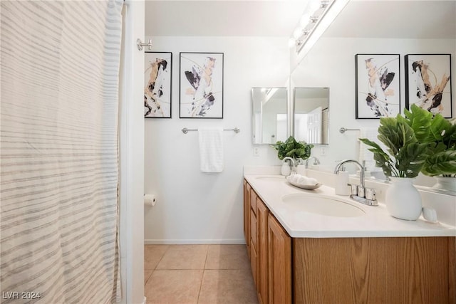 bathroom with tile patterned floors and vanity