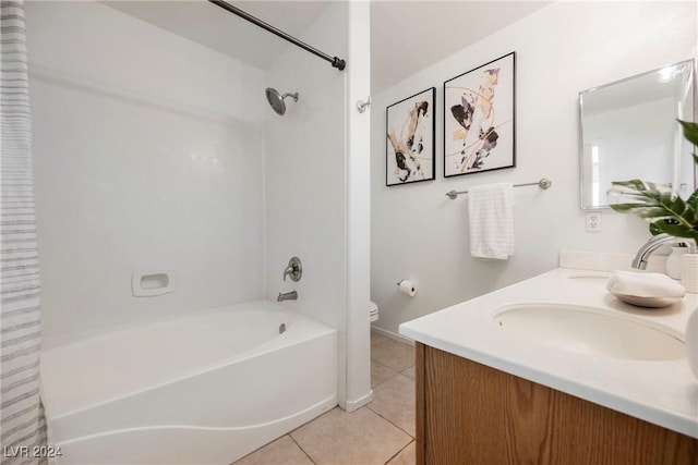 full bathroom featuring tile patterned floors, shower / bathtub combination with curtain, vanity, and toilet