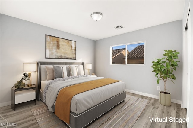 bedroom with wood-type flooring