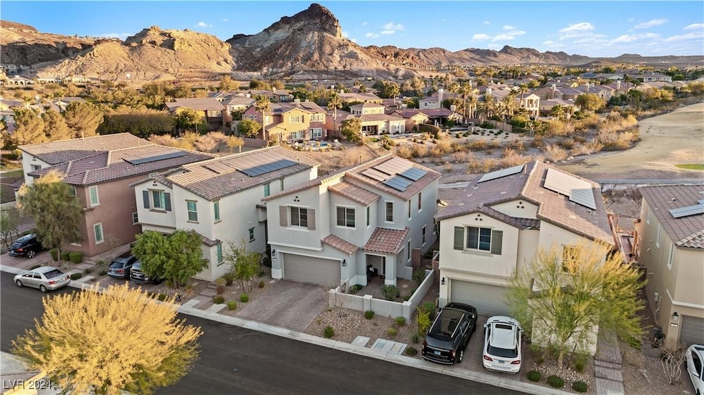 birds eye view of property with a mountain view