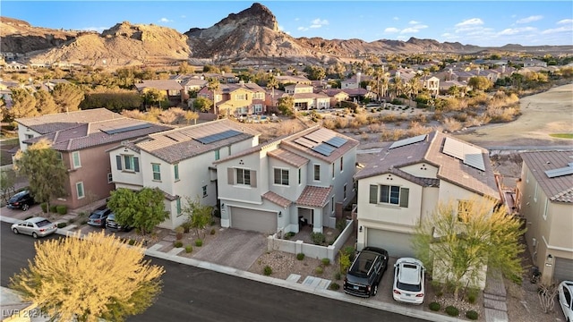 birds eye view of property with a mountain view