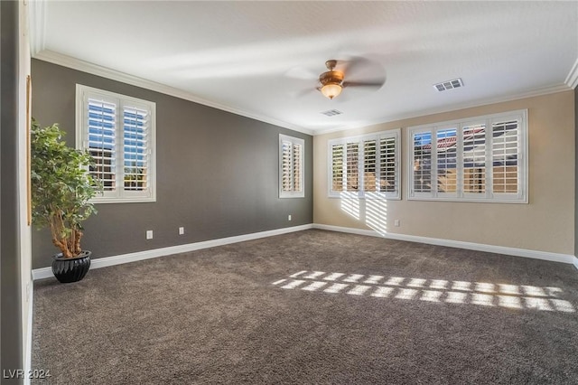 carpeted spare room featuring crown molding and ceiling fan