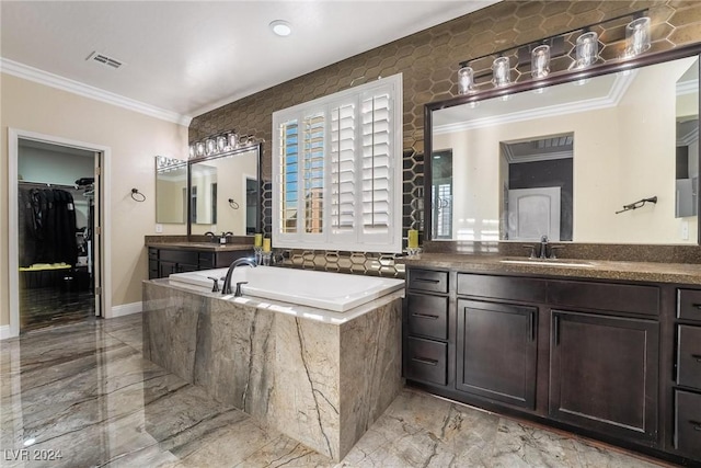 bathroom featuring crown molding, vanity, and a relaxing tiled tub