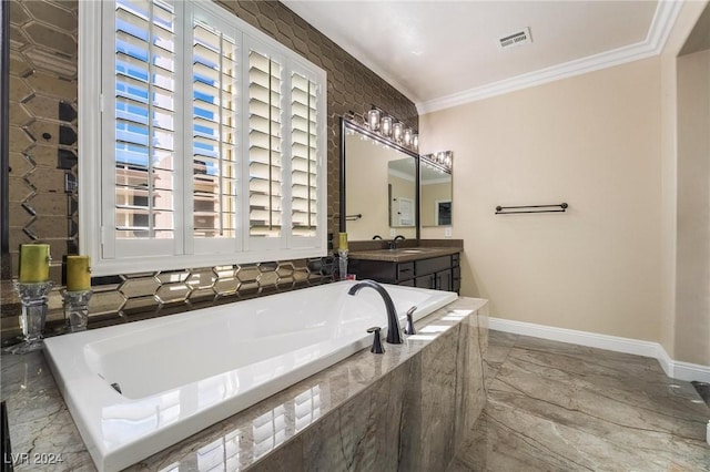 bathroom with vanity, ornamental molding, and tiled bath