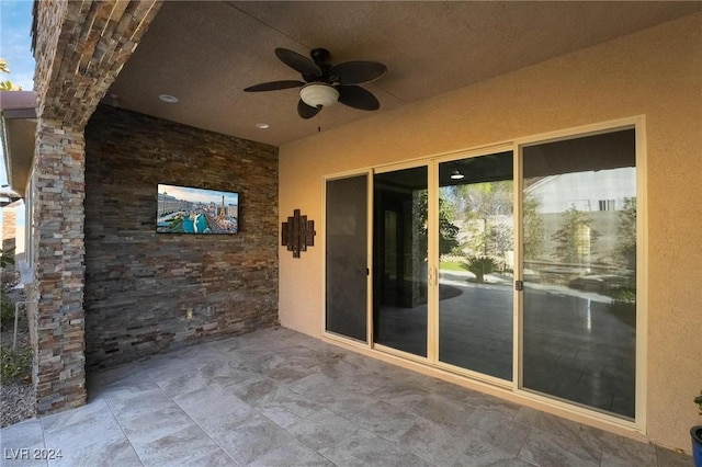 view of patio / terrace featuring ceiling fan