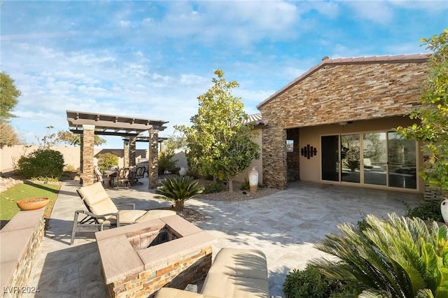 view of patio with a pergola and an outdoor fire pit