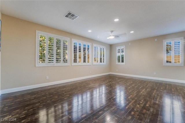 unfurnished room featuring dark hardwood / wood-style flooring and ceiling fan