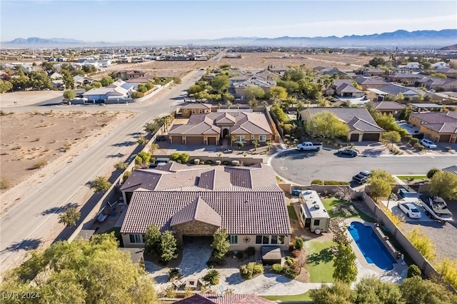 birds eye view of property with a mountain view