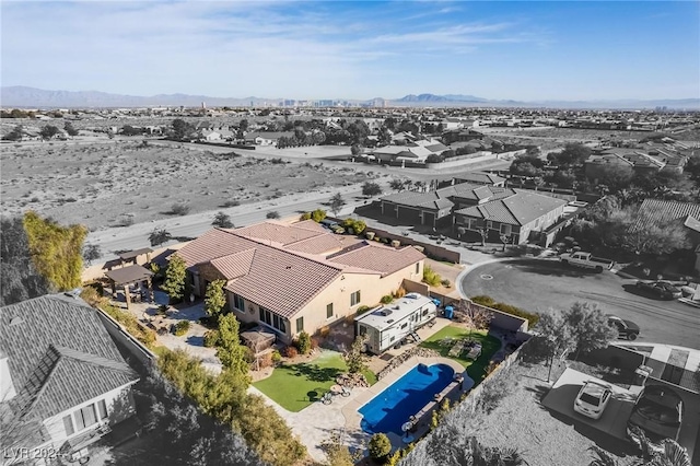 birds eye view of property with a mountain view