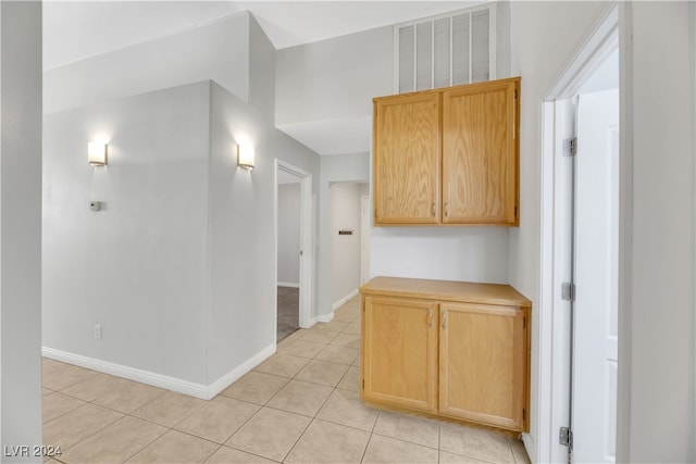 corridor featuring light tile patterned flooring