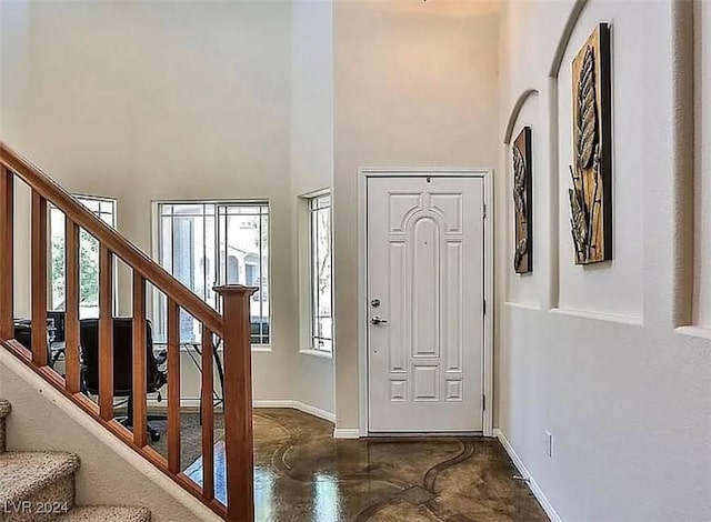 foyer featuring a high ceiling