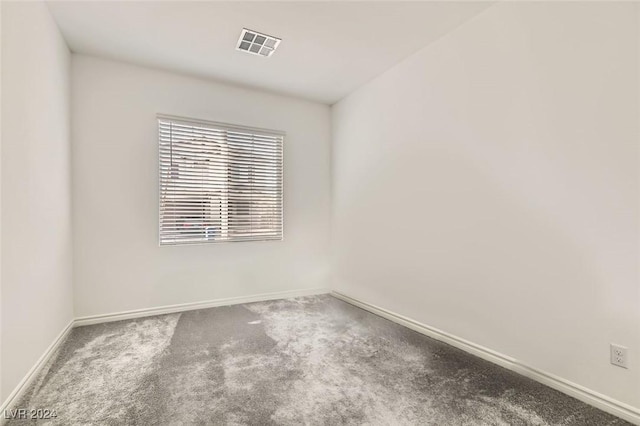 empty room with carpet flooring