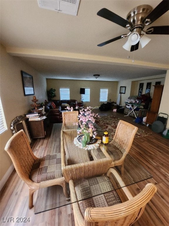 dining space featuring ceiling fan and hardwood / wood-style floors