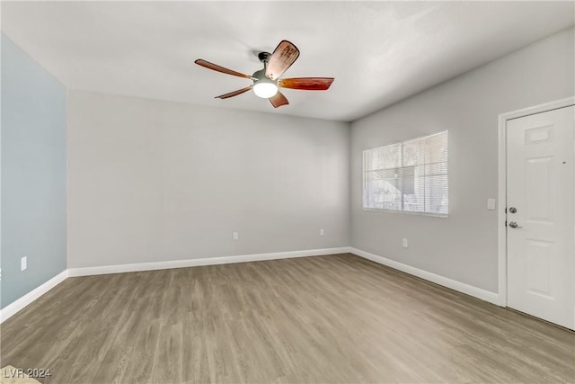 unfurnished room with light hardwood / wood-style floors and ceiling fan