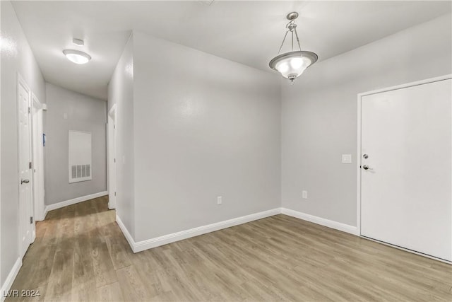 empty room featuring hardwood / wood-style flooring