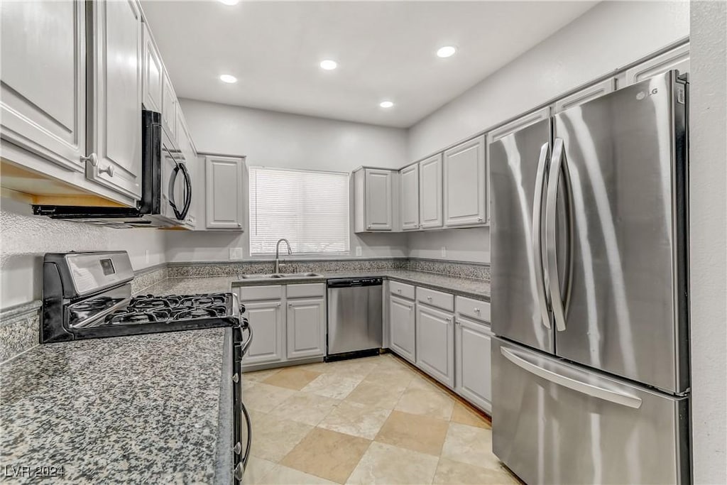 5250 S Rainbow Blvd Unit 2158, Las Vegas, NV 89118 - kitchen featuring gray cabinetry, sink, dark stone countertops, and black appliances