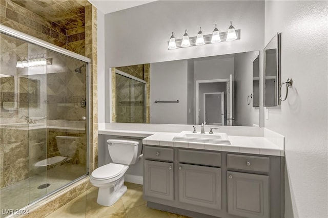 bathroom with tile patterned floors, vanity, toilet, and an enclosed shower