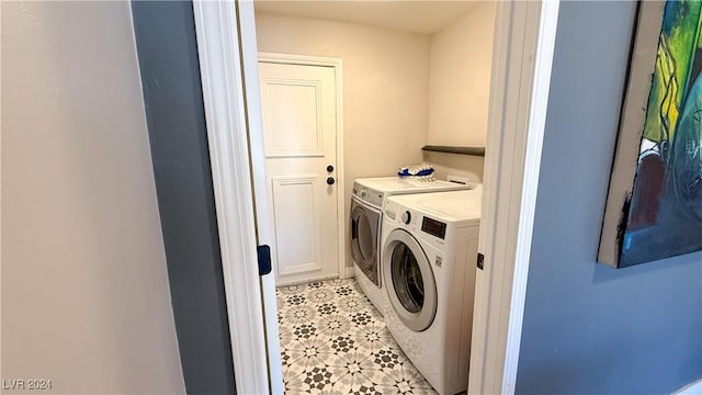 clothes washing area featuring washer and dryer