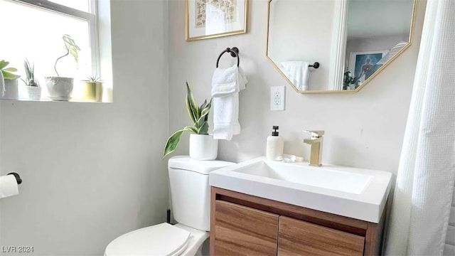 bathroom with vanity and toilet