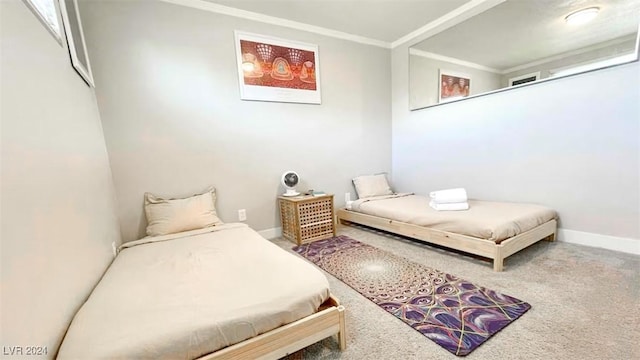 bedroom with carpet flooring and crown molding