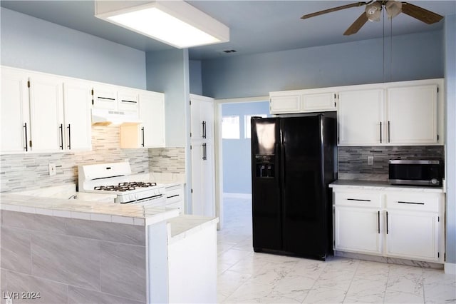 kitchen with white cabinets, white gas range oven, range hood, tasteful backsplash, and black fridge with ice dispenser