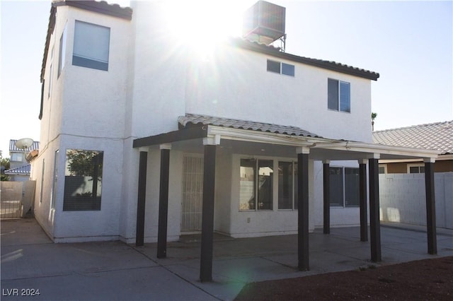 rear view of property featuring a patio