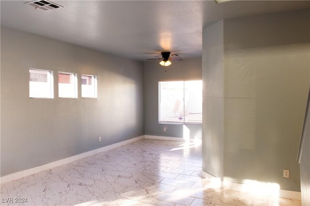 unfurnished room with ceiling fan