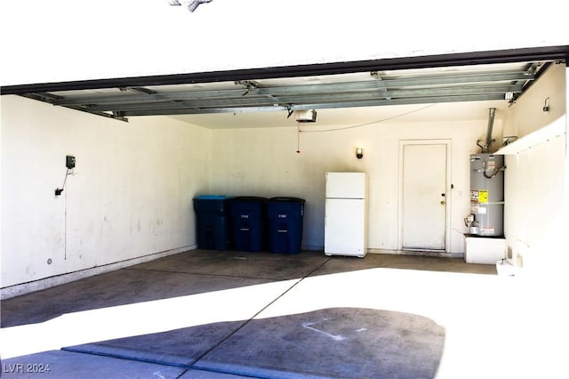 garage featuring white fridge, strapped water heater, and a garage door opener