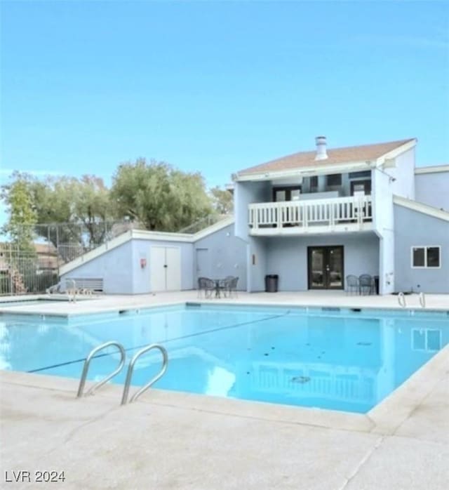 view of pool featuring a patio