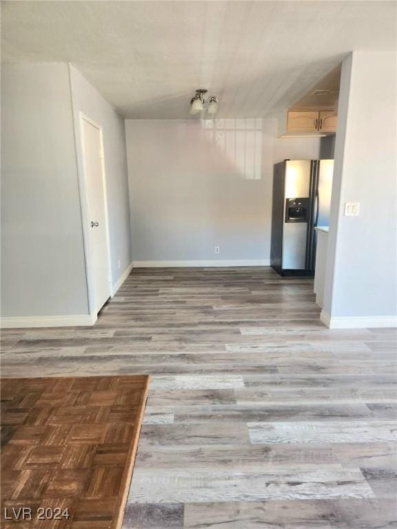 unfurnished dining area with hardwood / wood-style flooring