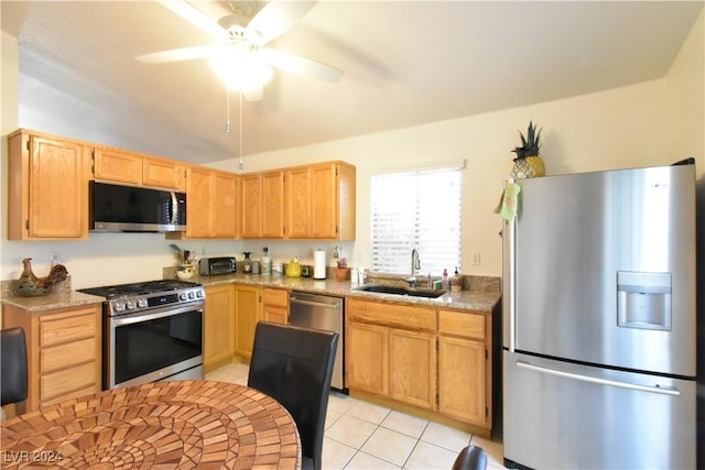 kitchen with sink, ceiling fan, light brown cabinetry, light tile patterned flooring, and stainless steel appliances