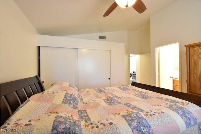 bedroom with ceiling fan, a closet, and vaulted ceiling