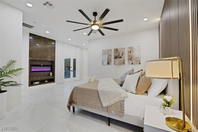 bedroom featuring ceiling fan and french doors