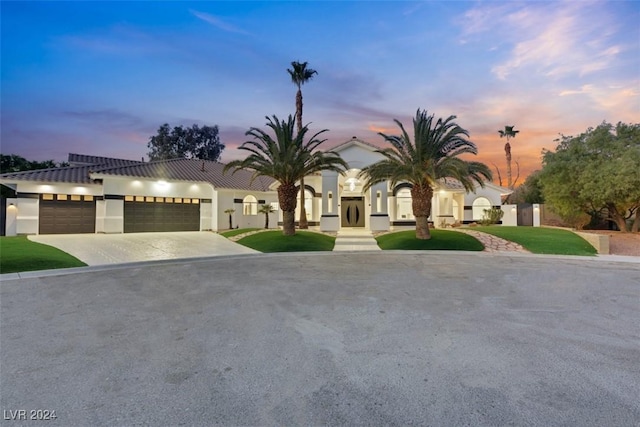 mediterranean / spanish-style house featuring a garage