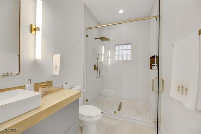 bathroom featuring toilet, tile patterned flooring, vanity, and walk in shower