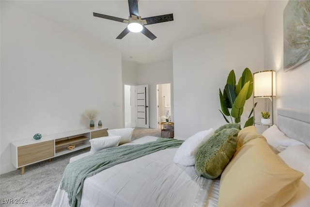 bedroom featuring ceiling fan and light carpet