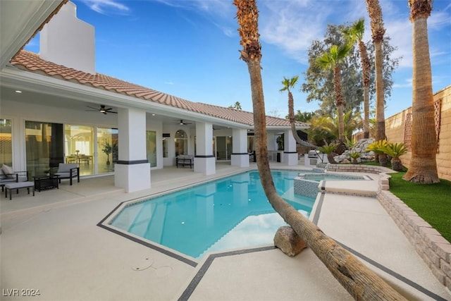 view of pool featuring an in ground hot tub, a patio, and ceiling fan