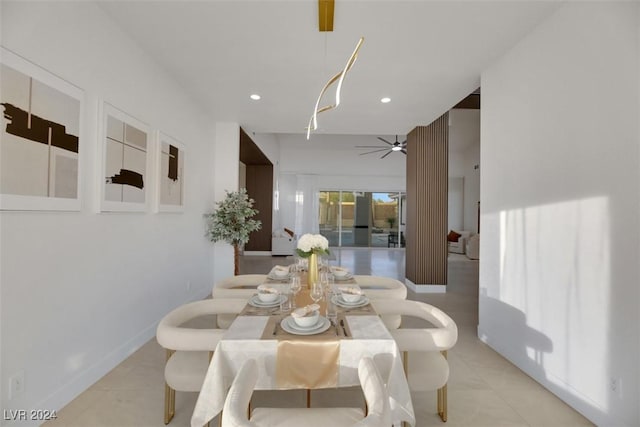 tiled dining area featuring ceiling fan