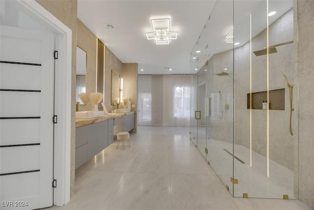 bathroom featuring vanity and an enclosed shower