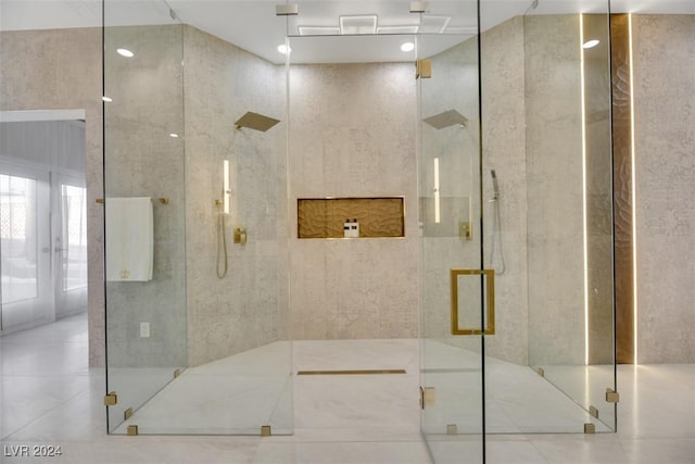 bathroom featuring a shower with shower door