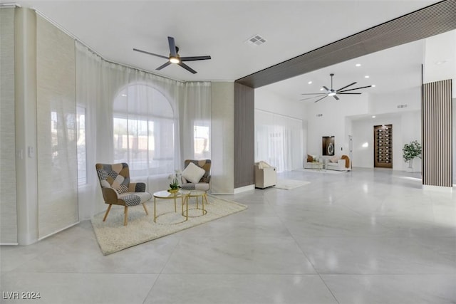 sitting room featuring ceiling fan